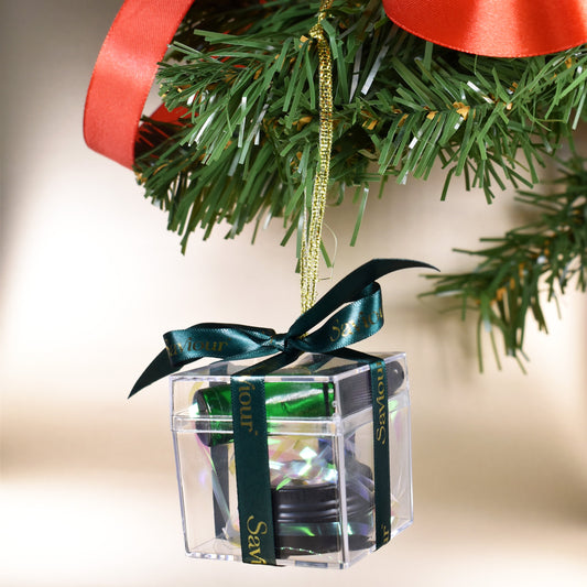 Luxury Clear Bauble with Mini cosmetics tied with a emerald ribbon.